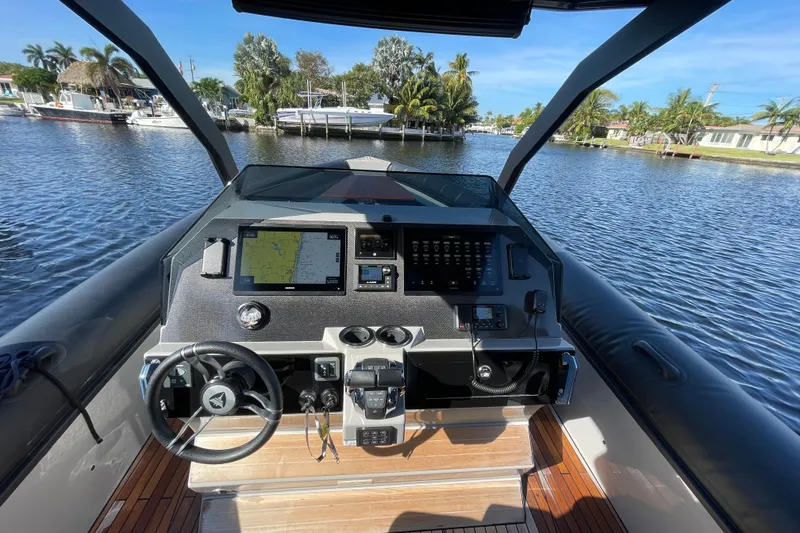Slide: The Image of Cockpit view of 2023 Skipper-BSK BSK 38 boat with navigation equipment on a sunny day. - 30