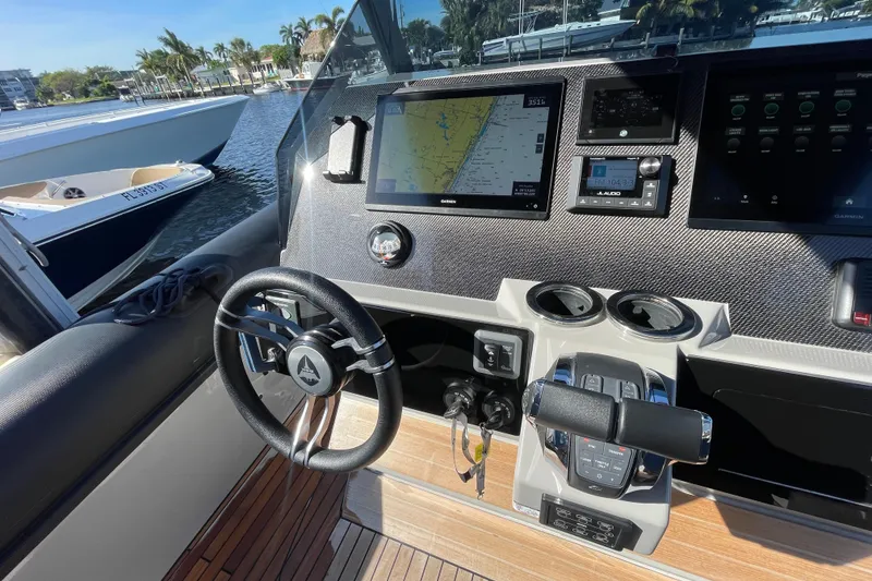 Slide: The Image of Cockpit of 2023 Skipper-BSK BSK 38 boat with advanced navigation system and steering wheel. - 31