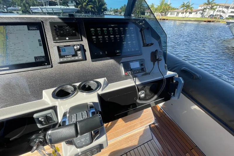 Slide: The Image of 2023 Skipper-BSK BSK 38 boat dashboard with navigation and control systems. - 32