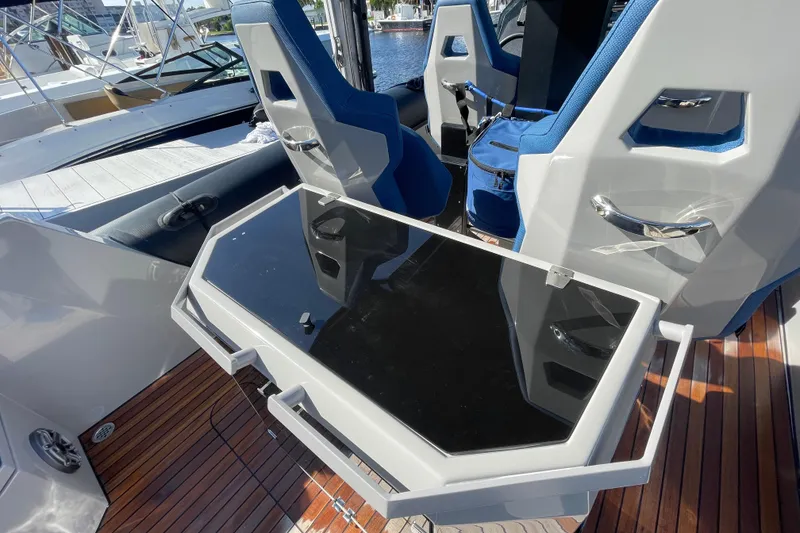 Slide: The Image of 2023 Skipper-BSK BSK 38 boat interior with sleek seating and modern table design. - 39