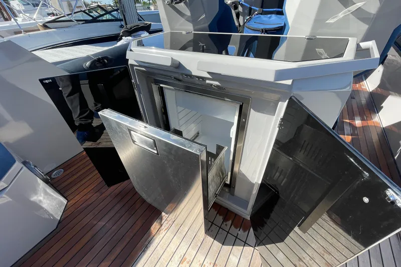 Slide: The Image of 2023 Skipper-BSK BSK 38 yacht interior with open storage compartments on wooden deck. - 42