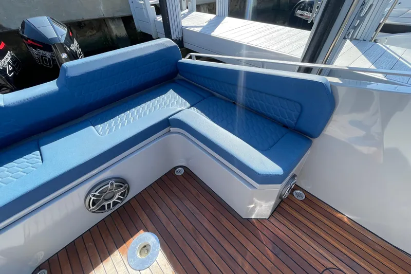 Slide: The Image of 2023 Skipper-BSK BSK 38 boat with blue seating and teak deck. - 45