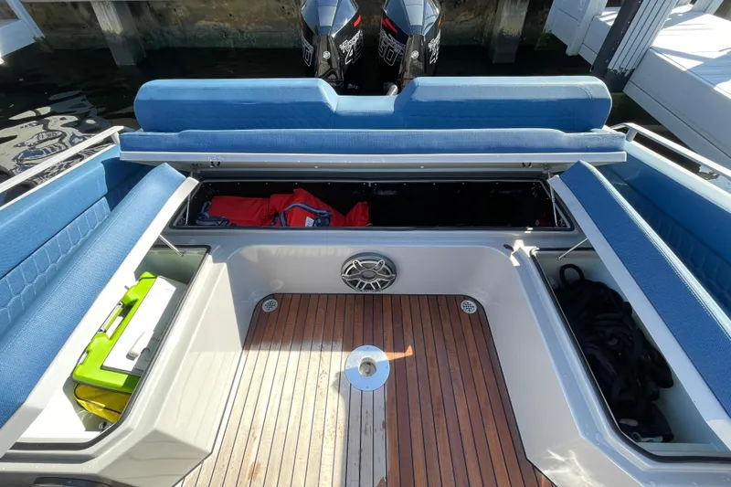 Slide: The Image of 2023 Skipper-BSK BSK 38 boat interior with blue seating and storage compartments. - 46