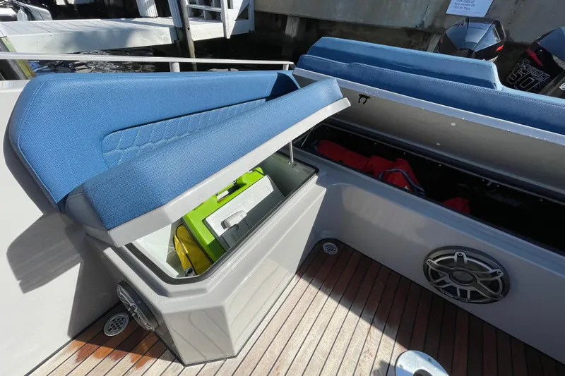 Slide: The Image of 2023 Skipper-BSK BSK 38 boat with open storage compartments and blue seating. - 47