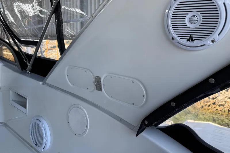Slide: The Image of 2005 Meridian 341 Sedan interior with speakers and window details. - 37