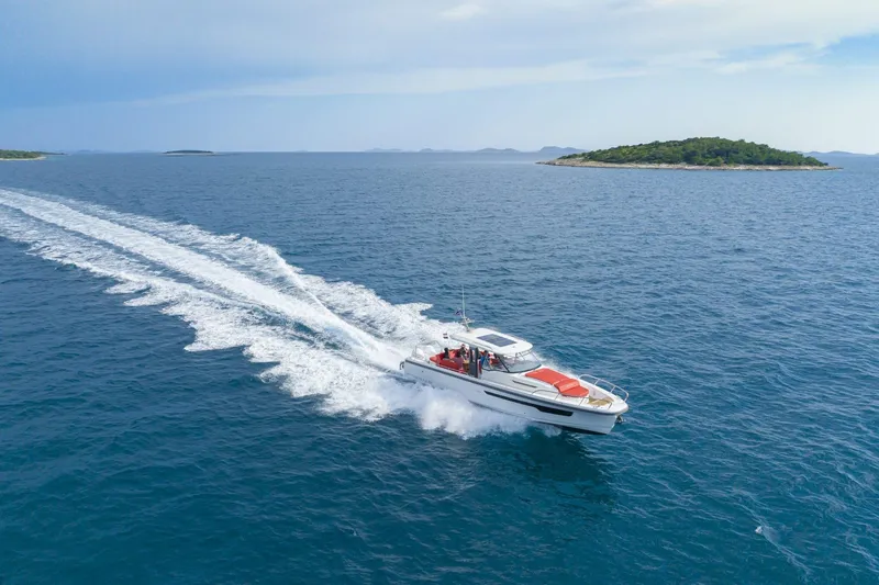 Slide: The Image of Nimbus Tender 11 boat 2025 cruising on open sea. - 1