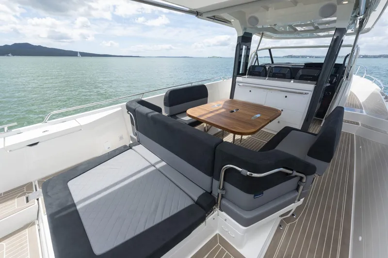 Slide: The Image of Nimbus Tender 11 2025: Luxurious deck with seating area and table on the water. - 17
