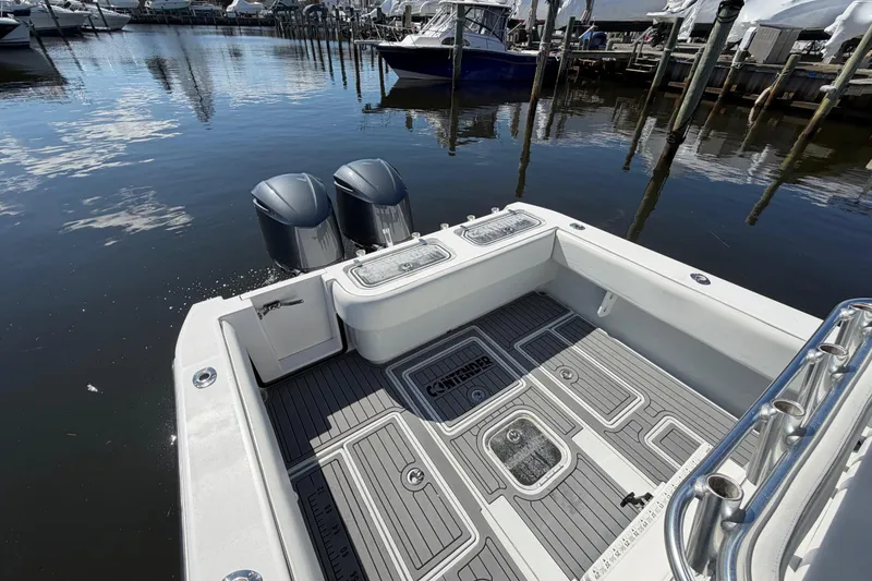 Slide: The Image of 2015 Contender 32 ST boat with dual engines docked at marina. - 21