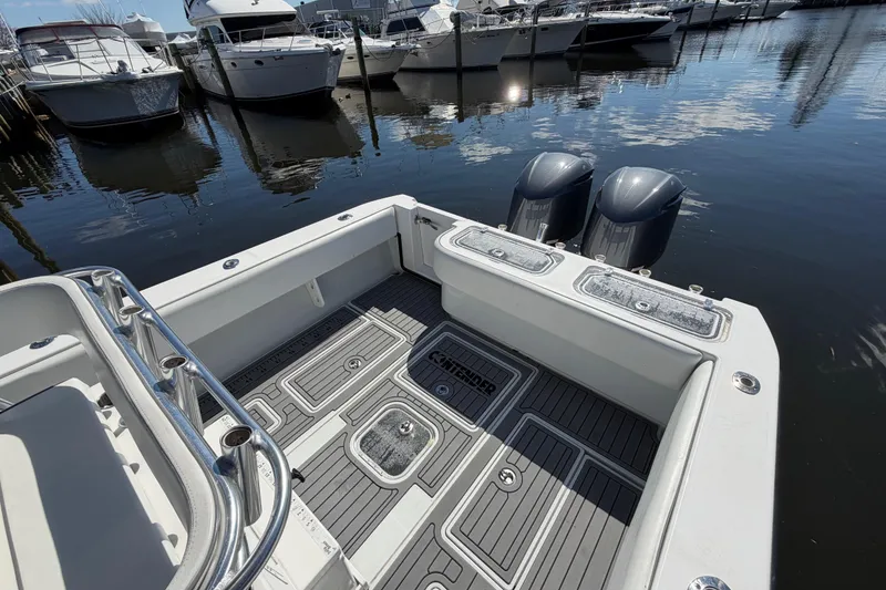Slide: The Image of 2015 Contender 32 ST boat with dual engines docked at marina. - 22