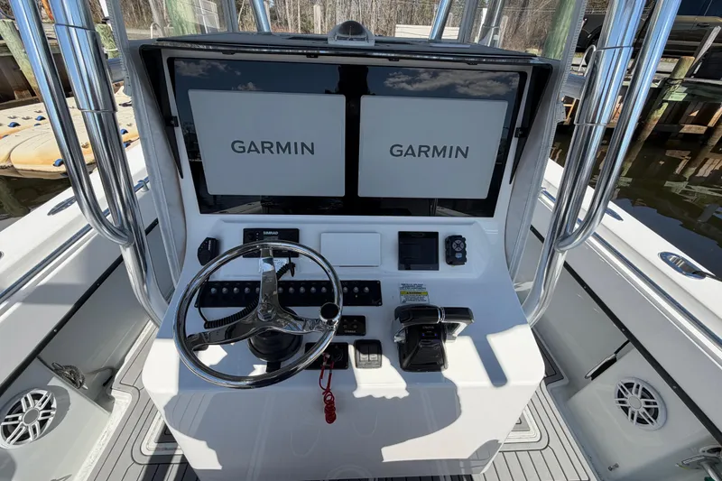 Slide: The Image of Center console of a 2015 Contender 32 ST boat with Garmin displays. - 29