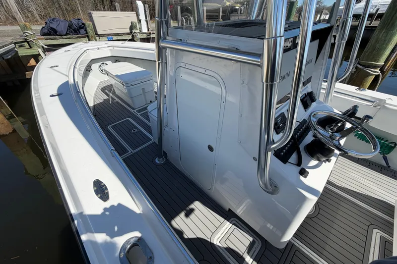 Slide: The Image of 2015 Contender 32 ST boat interior with steering console and seating area. - 33