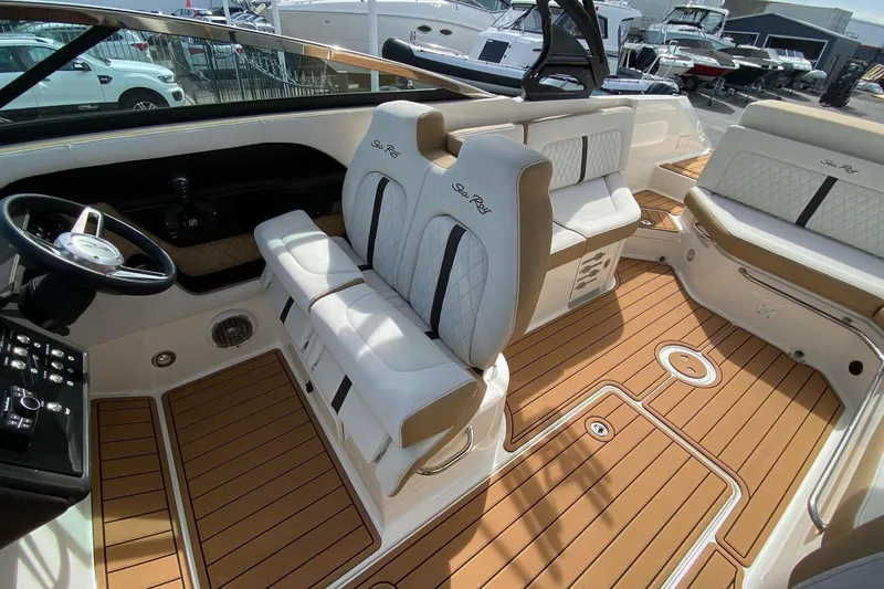 Slide: The Image of Interior of a 2016 Sea Ray SLX 280 boat with luxurious seating and teak flooring. - 4
