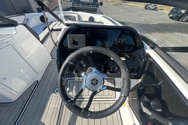 Slide: The Image of 2025 Yamaha Boats 195S steering console with modern controls and sleek design. - 6