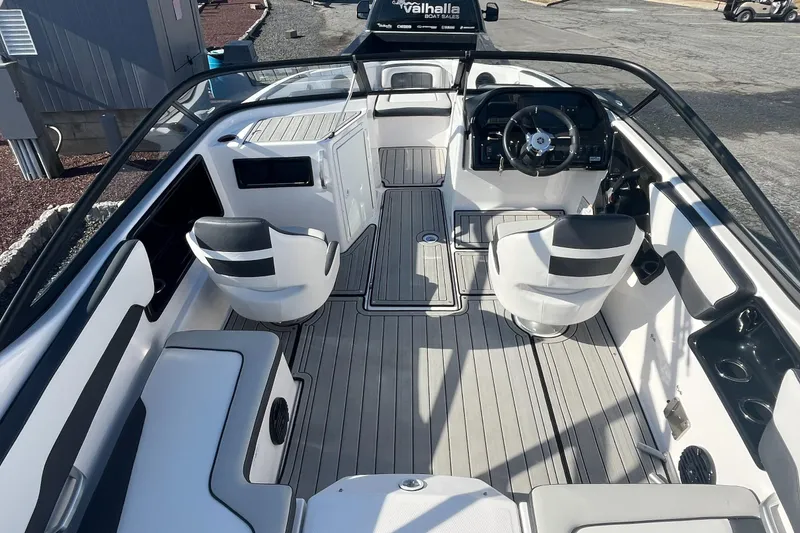 Slide: The Image of 2025 Yamaha Boats 195S interior with sleek seating and modern dashboard design. - 8