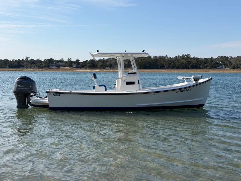 Slide: The Image of 2022 Eastern 22 Center Console boat on calm water. - 1