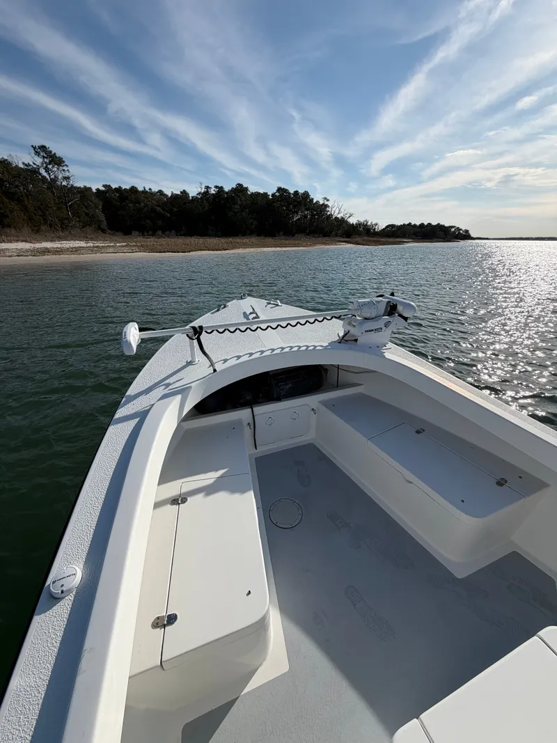 Slide: The Image of Eastern 22 Center Console boat 2022 on calm water under sunny sky. - 7