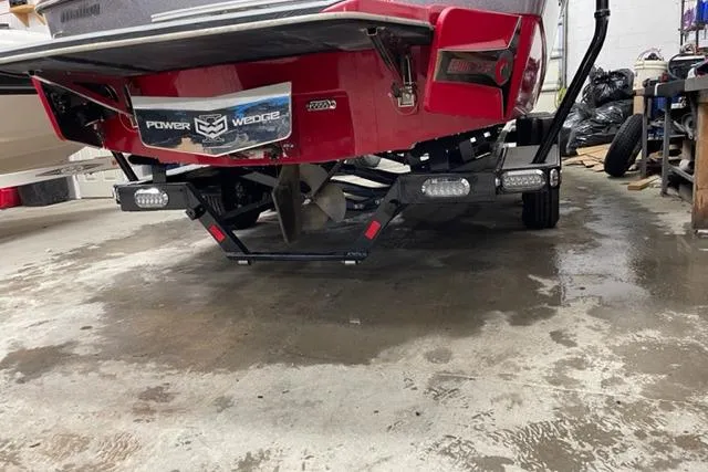 Slide: The Image of 2018 Malibu Wakesetter 23 LSV boat rear view in a garage setting. - 2