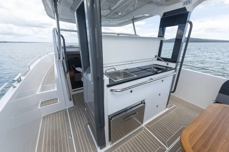 Slide: The Image of Nimbus Tender 11, 2025, featuring a modern outdoor kitchen on deck. - 13