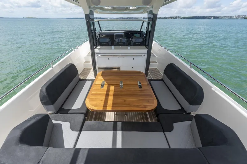 Slide: The Image of Nimbus Tender 11, 2025, luxurious boat seating area on the water. - 18