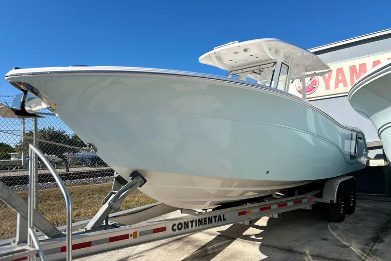 The Image of 2026 Sea Fox 288 Commander boat on trailer under clear blue sky. - 0