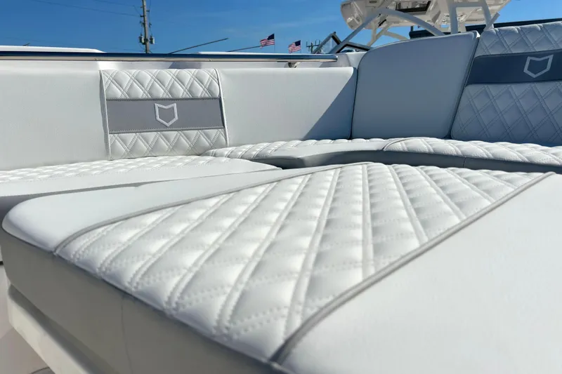 Slide: The Image of Luxurious seating on 2026 Sea Fox 288 Commander boat, featuring elegant diamond stitching. - 11