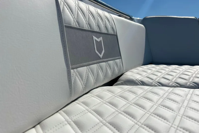 Slide: The Image of Luxurious white seating on 2026 Sea Fox 288 Commander boat under clear blue sky. - 12