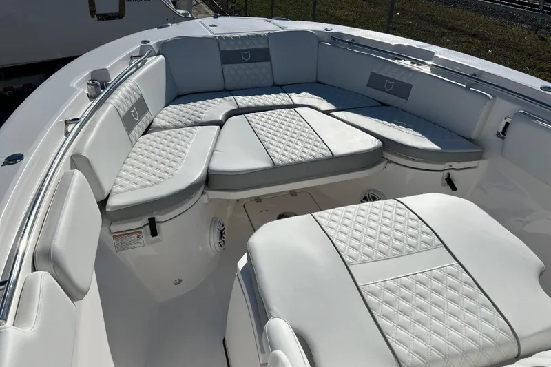 Slide: The Image of 2026 Sea Fox 288 Commander boat with luxurious white seating and quilted upholstery. - 13