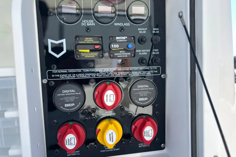 Slide: The Image of Control panel of 2026 Sea Fox 288 Commander boat with battery switches and digital displays. - 18