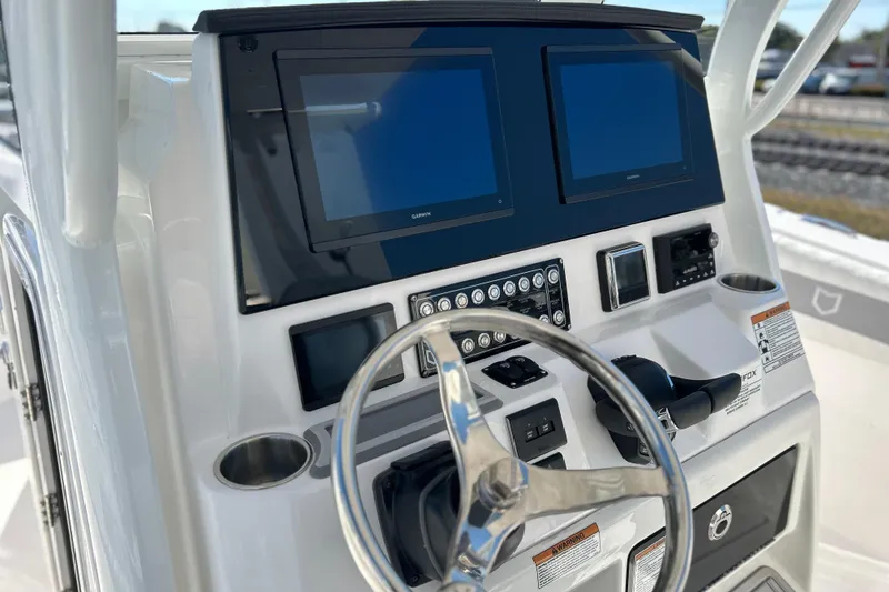 Slide: The Image of 2026 Sea Fox 288 Commander dashboard with dual screens and steering wheel. - 2