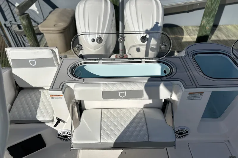 Slide: The Image of 2026 Sea Fox 288 Commander boat interior with seating and storage compartments. - 21