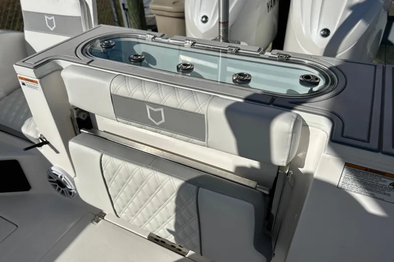 Slide: The Image of 2026 Sea Fox 288 Commander boat interior with cushioned seating and storage. - 26