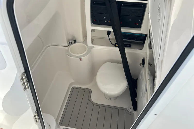 Slide: The Image of 2026 Sea Fox 288 Commander boat bathroom interior with toilet and sink. - 30