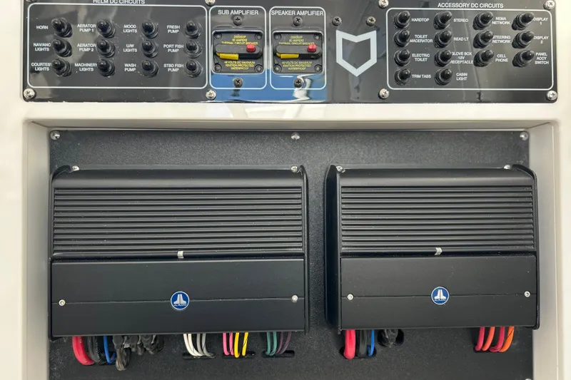 Slide: The Image of Control panel of 2026 Sea Fox 288 Commander boat with amplifiers and circuit switches. - 31