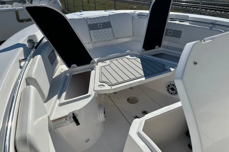 Slide: The Image of 2026 Sea Fox 288 Commander boat interior with open storage compartments and seating. - 33