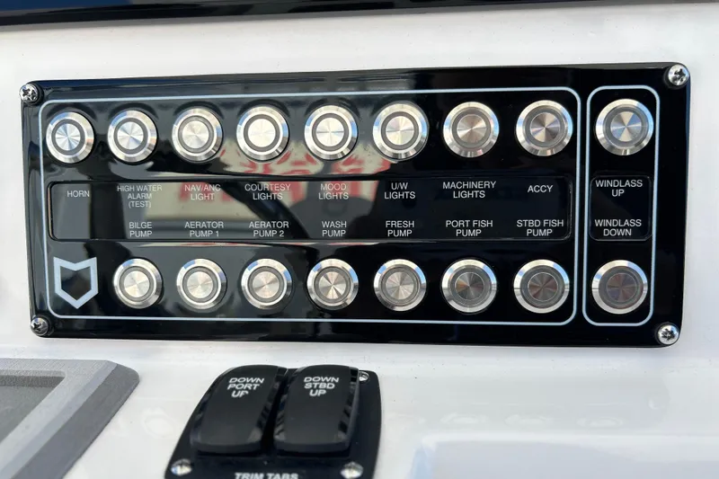Slide: The Image of Control panel of 2026 Sea Fox 288 Commander boat with labeled buttons and switches. - 5