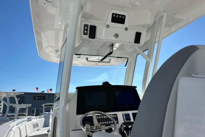 Slide: The Image of 2026 Sea Fox 288 Commander boat interior with modern dashboard and steering wheel. - 8