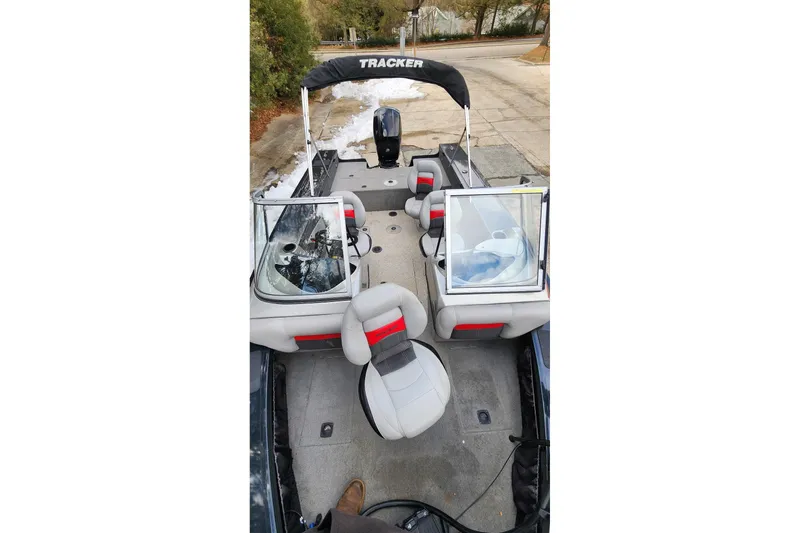 Slide: The Image of 2013 Tracker Targa V-18 WT boat interior with seating and windshield. - 3