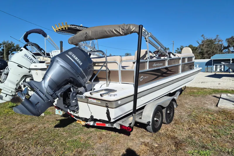 Slide: The Image of 2013 Hurricane FunDeck 226 boat with Yamaha outboard motor on trailer. - 3
