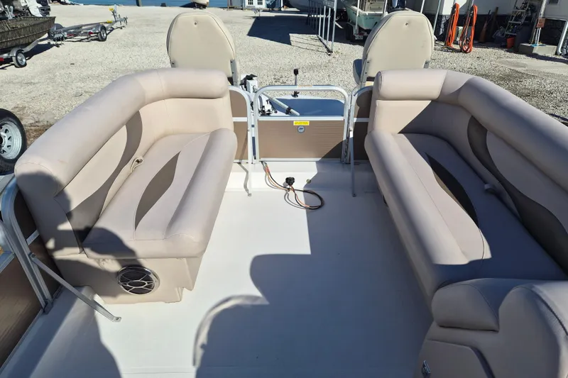 Slide: The Image of 2013 Hurricane FunDeck 226 interior with beige seating and spacious layout. - 9