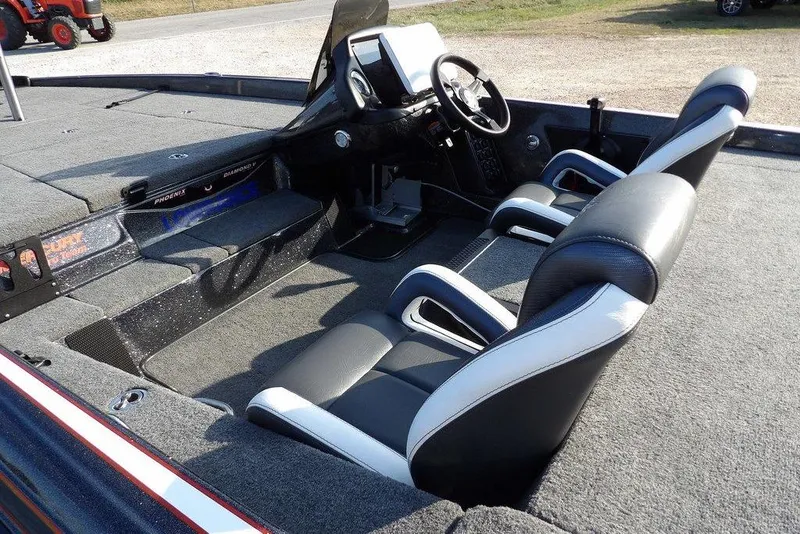 Slide: The Image of 2024 Phoenix 721 ProXP boat interior with dual seats and steering console. - 10