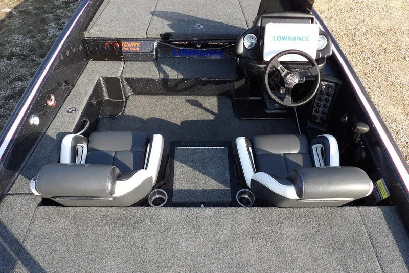 Slide: The Image of 2024 Phoenix 721 ProXP boat interior with dual seats and steering console. - 12