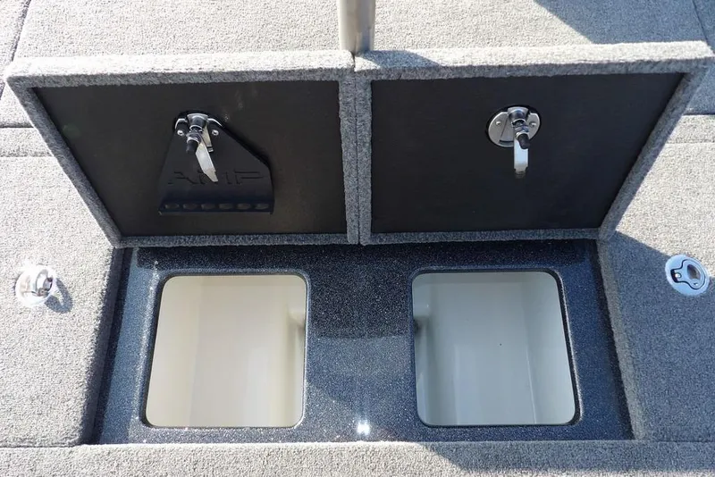 Slide: The Image of 2024 Phoenix 721 ProXP boat storage compartments with open lids, showcasing interior space. - 15