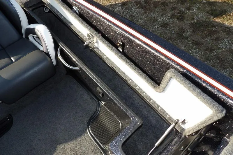 Slide: The Image of 2024 Phoenix 721 ProXP interior with sleek seating and storage compartment. - 18