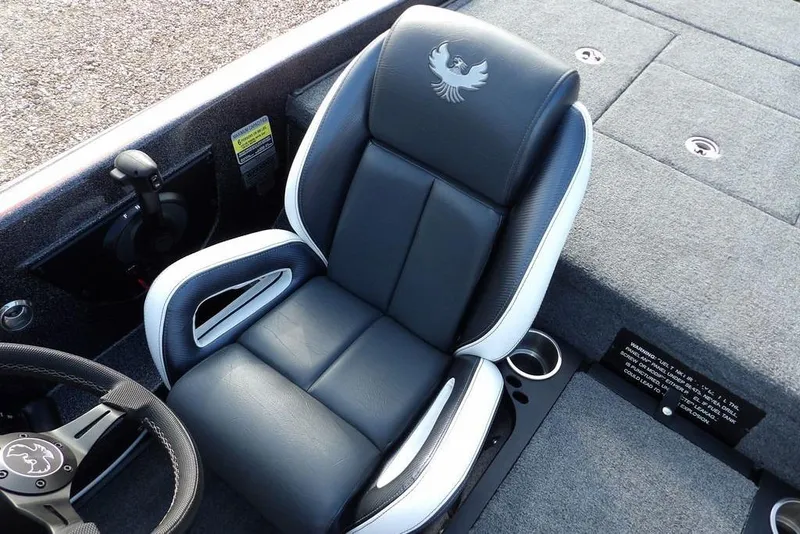 Slide: The Image of 2024 Phoenix 721 ProXP boat seat with logo, featuring sleek black and white design. - 27