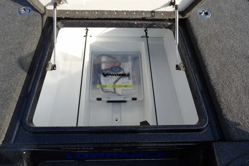 Slide: The Image of 2024 Phoenix 721 ProXP storage compartment with Lowrance equipment. - 28