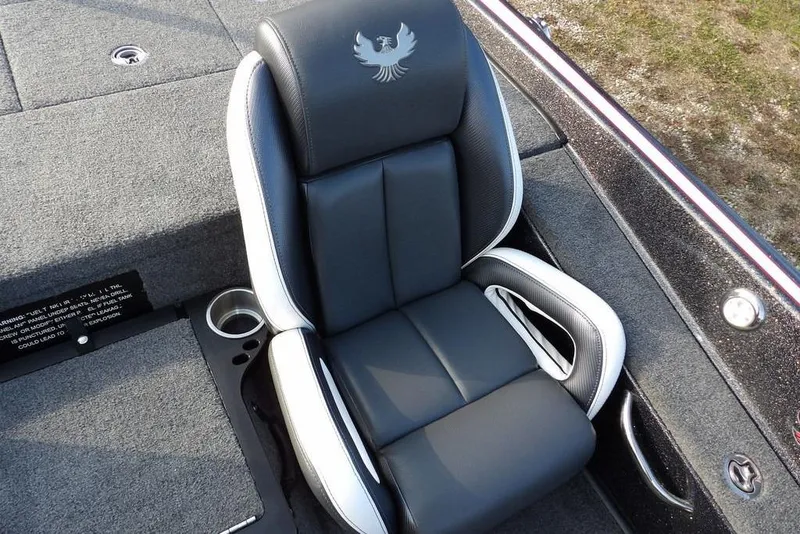 Slide: The Image of 2024 Phoenix 721 ProXP boat seat with logo, featuring sleek black and white design. - 29