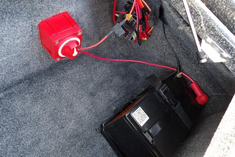 Slide: The Image of 2024 Phoenix 721 ProXP battery compartment with red power switch and wiring. - 32