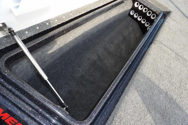 Slide: The Image of 2024 Phoenix 721 ProXP boat storage compartment with hydraulic lift and rod holders. - 33