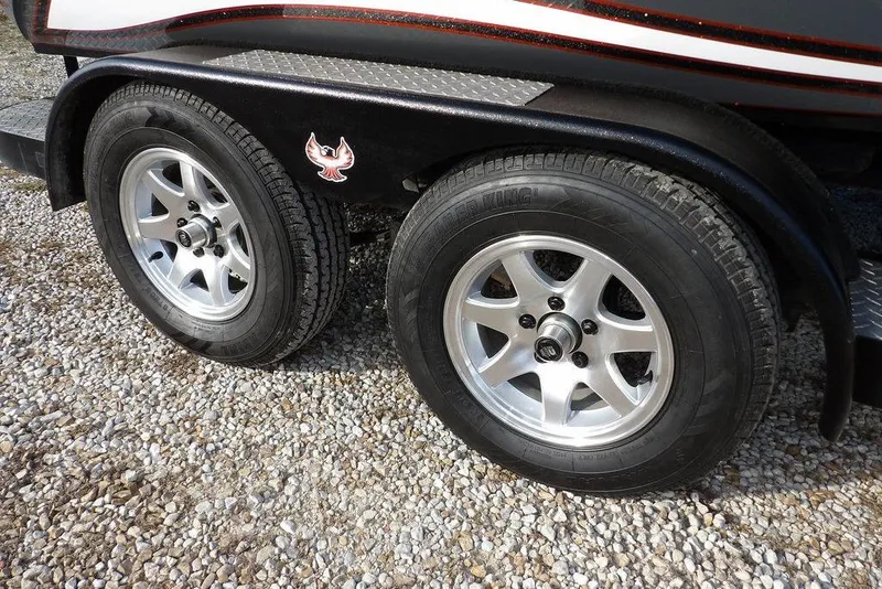 Slide: The Image of 2024 Phoenix 721 ProXP trailer wheels on gravel surface. - 47