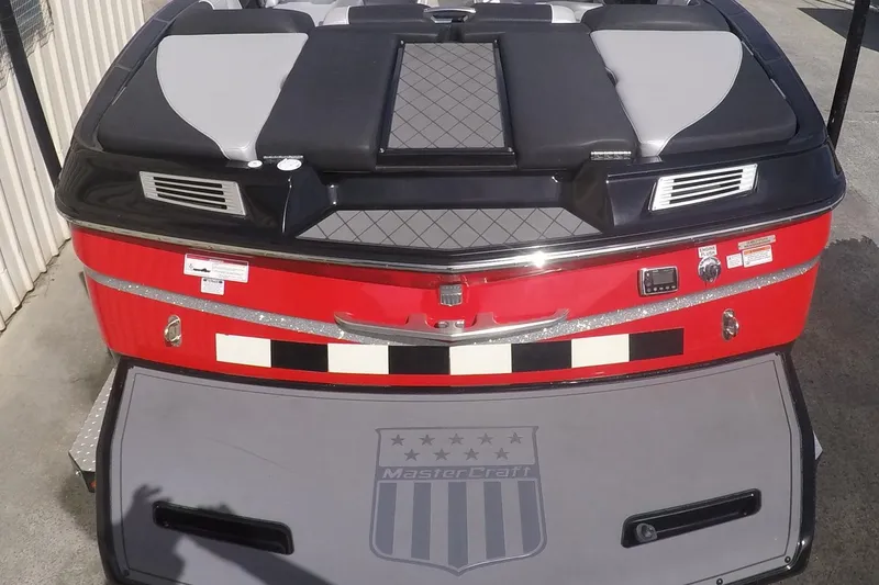 Slide: The Image of 2017 MasterCraft X10 boat rear view with red and black design. - 6